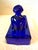 Blue glass bathing beauty. Cobalt blue glass dish. She glows. She is 6 x 2.5 x 4 inches tall. In great condition. Marked...