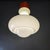 Pendant lamp in pure Space Age style in milky white opaline glass (mushroom cloud) with orange metal base. Height from the...