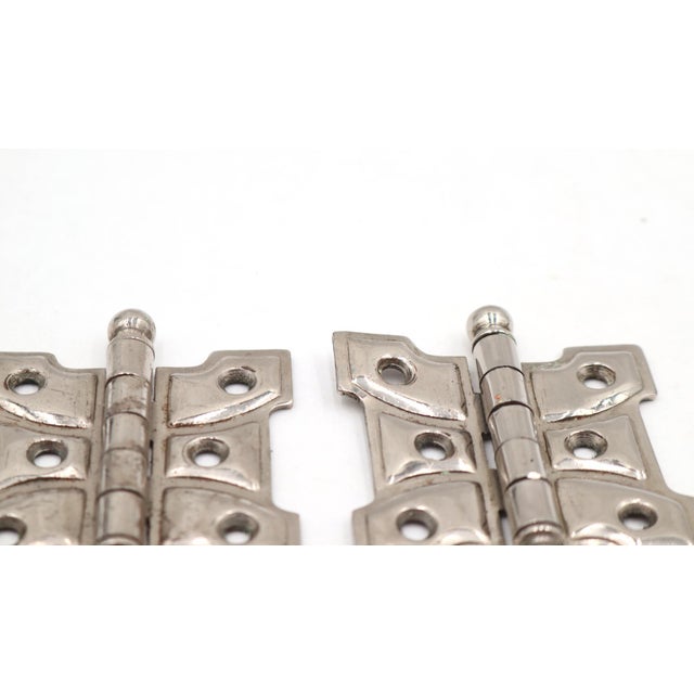 Vintage butterfly cabinet hinges made of steel with a chrome finish. They feature ball tips, five knuckles, and a template...