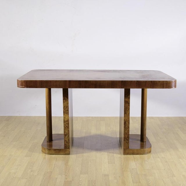 This majestic vintage table embodies the luxury and geometric precision of the 1930s art deco style. Crafted from a...