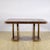 This majestic vintage table embodies the luxury and geometric precision of the 1930s art deco style. Crafted from a...