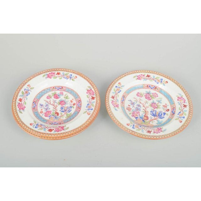 Cauldon China, England Deep plates, mid-20th century. Set of three deep faience plates with colourful, orientalist-...