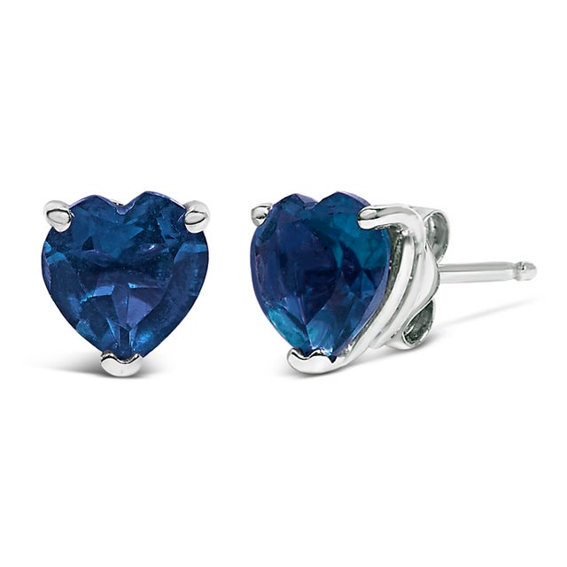 Discover the quintessence of elegance with these heart-shaped blue sapphire stud earrings, exquisitely cradled in 14K...