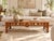 An antique Chinese bed, cut down and made into a long, low coffee table. The woven seat now serves as the top, set within...