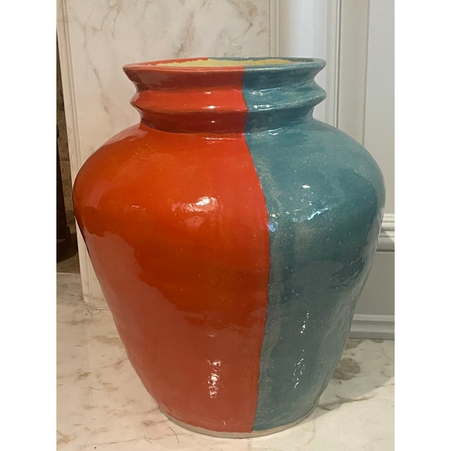 Blue and red vase custom made by artist Julia Elsas for Edie Parker.