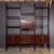 An Italian modular wall unit in warm-toned hardwood, attributed to Franco Albini and dating to the late 1950s. The system...