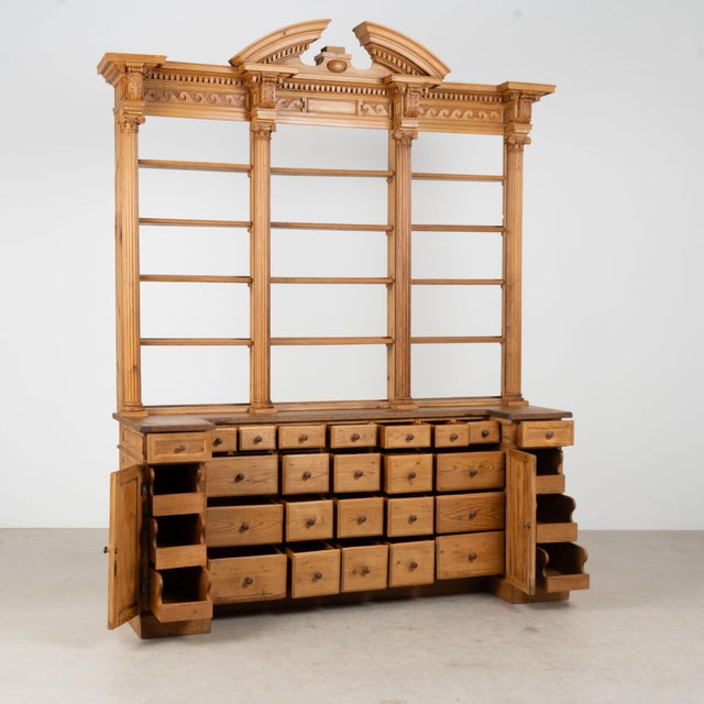 Large 19th century Danish bookcase, crafted in pine with an impressive architectural form and a distinctive 24-drawer...