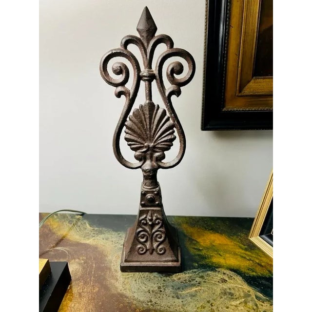 Antique finial that was once part of a garden gate or fence. inside the finial you can see how it was attached. This...