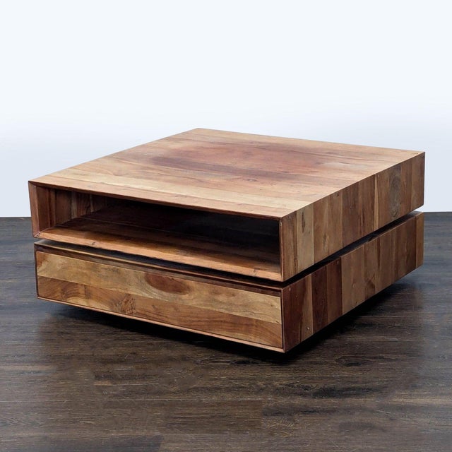 This table is made from engineered wood with an Acacia veneer. Brand: CB2. Dimensions (in): 32W x 32D x 15H.