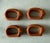 Set of 4 vintage terracotta napkin rings shaped like adorable pigs.