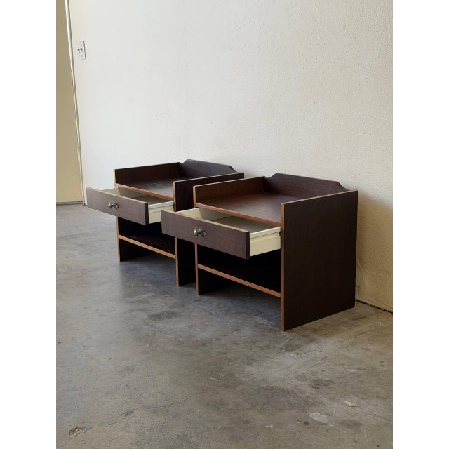 Beautiful pair of Mid Century Modern Danish nightstands by Denka, crafted in warm teak and made in Denmark. These matching...