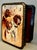 Celebrate the artistry of Russian craftsmanship with this vintage papier-mâché lacquered box, adorned with a sporting dogs...