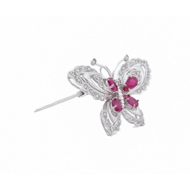 14K White Gold Ruby Diamond Butterfly Pin, featuring 4 pear brilliant rubies weighing a total of approx. 1.00 carat,...