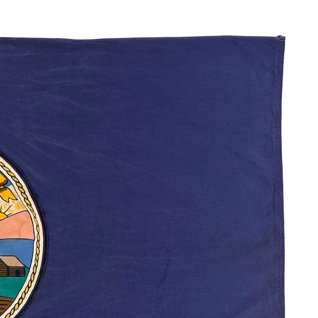 This vintage Kansas flag is made from a cotton cloth, with sewn letters and printed emblem visible on both sides. Please...