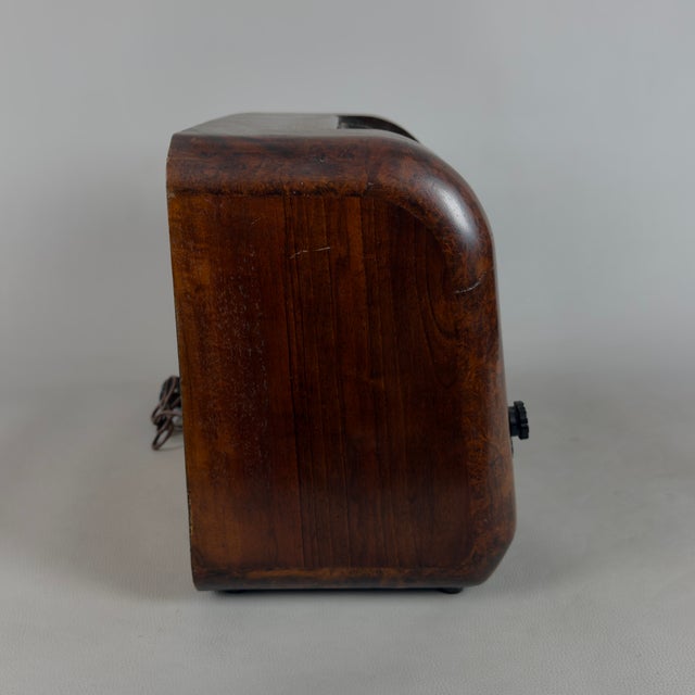 A fascinating piece of italian broadcasting history, perfect for adding an unmistakable retro warmth to a living room or...