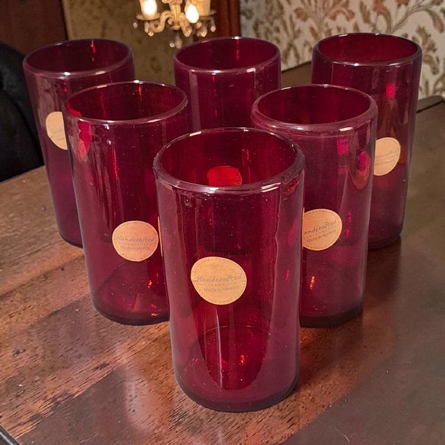 This set of six handcrafted red art glass tumblers from Mexico is a unique addition to any kitchen or dining table. These...