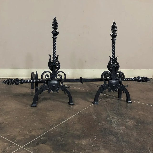 Pair 19th Century Country French Wrought Iron Andirons display the obvious talents of the metalsmith who created the set,...