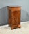 This bedside table has a drawer in burr mahogany, with a bowl button, in a belt and opens with an equally dark door with a...