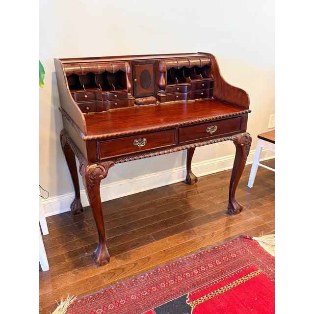 Antique Chippendale Escritoire A pretty and petite mahogany desk with carved details and ball and claw feet. In excellent...