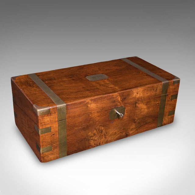 This is an antique writing slope. An English, walnut and brass correspondence box, dating to the Regency period, circa...