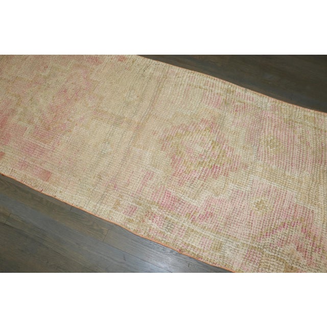 A pale pink mid 20th century Turkish Anatolian Runner