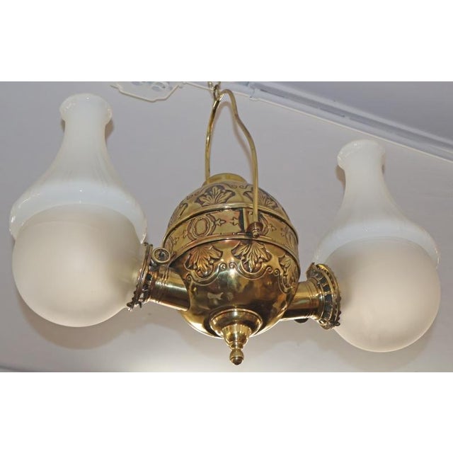 19th Century Angle Lamp Co. Double Angle Lamp Brass Kerosene Chandelier Dimensions : 24" Wide X 7" Deep X 18" Tall This...
