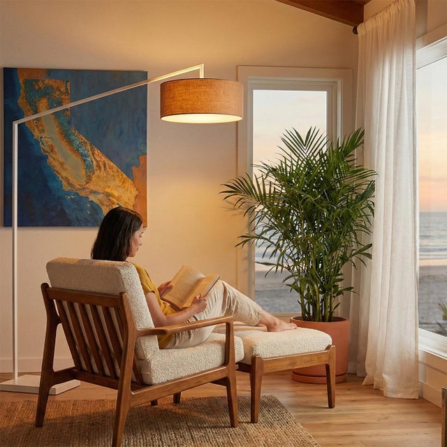 Built with white steel and a white composite base, the Stretch Arc Lamp is a Modern statement piece by designer KIRBY...