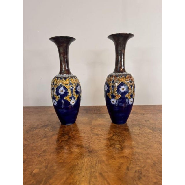 Beautiful quality pair of antique Doulton Lambeth vases having a lovely shaped vase with a fluted shaped brown neck above...
