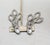 1980s rhodium plated prong set pear shaped top with round clear rhinestones drop with pointed ellipse shapes at the bottom...