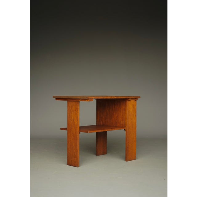 A rare early modernist Dutch side table in the Haagse School style. This piece is attributed to the mentioned...