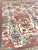 An exceptional hand knotted antique re-creation rug, featuring architectural elements and grand scale tribal motifs. Hand...