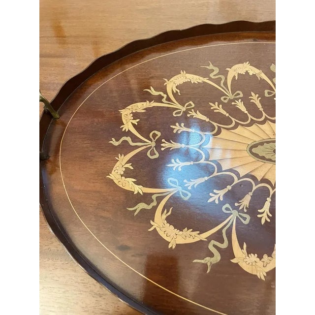 Outstanding quality Edwardian inlaid mahogany oval tray with original brass handles having a striking intricate inlaid...