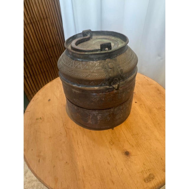 This exquisite antique Turkish copper storage vessel is a masterful representation of Ottoman-era craftsmanship, blending...