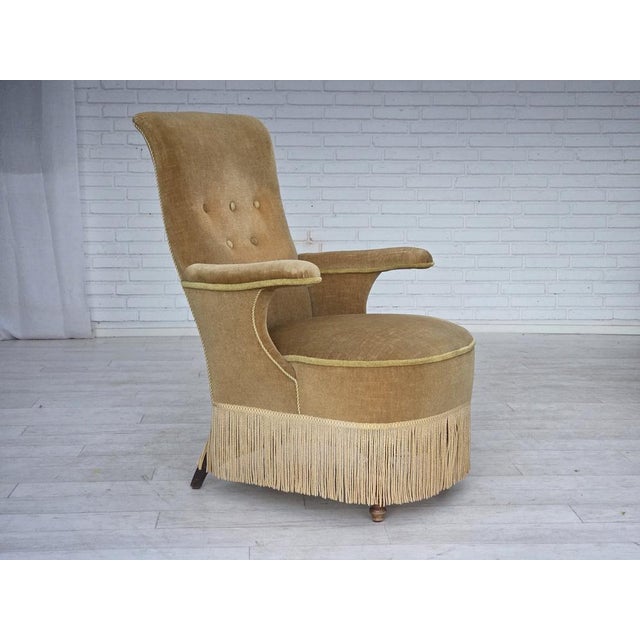 1950s, Danish armchair. Original green furniture velour, brass springs in the seat, ash wood legs. Original good...