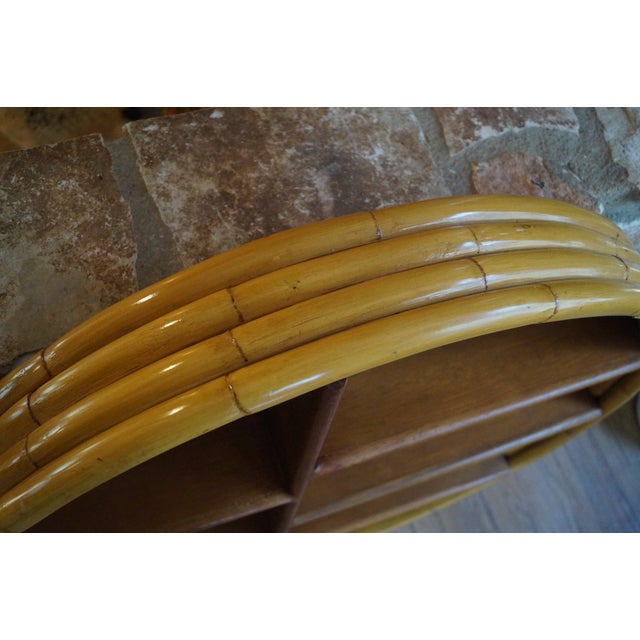 A classic Paul Frankl style rattan wall shelf which is perfect for a powder room or bar. A wonderful piece in very good...