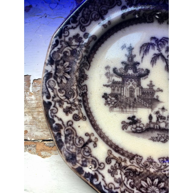 Transfer decorated in the "Corean" Pattern in a blackish-purple color on an ecru background - Plate is in very good...