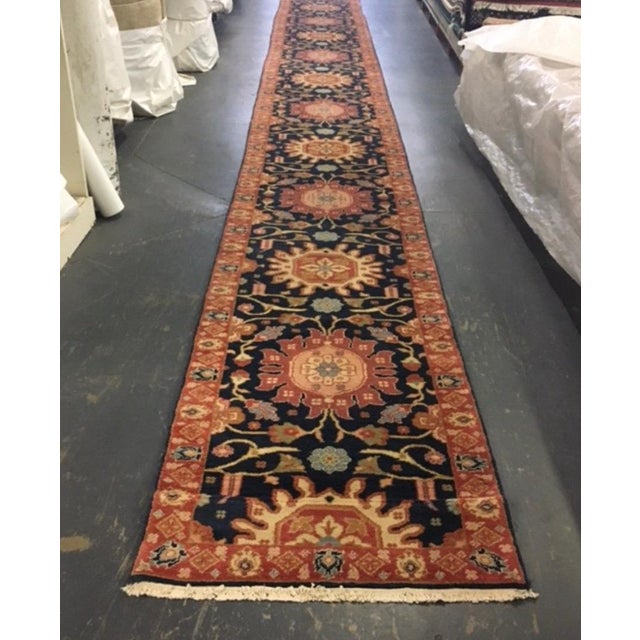 This is a new Late 20th Century Long and Narrow Navy Blue Persian Style Runner Rug handwoven in Alexandria, Egypt in...