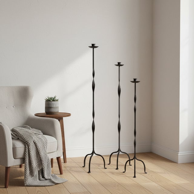 The Open Twist Trio: Floor Candelabra Set ️ Elevate your interior with a piece of true iron artistry. This Hand-Forged...