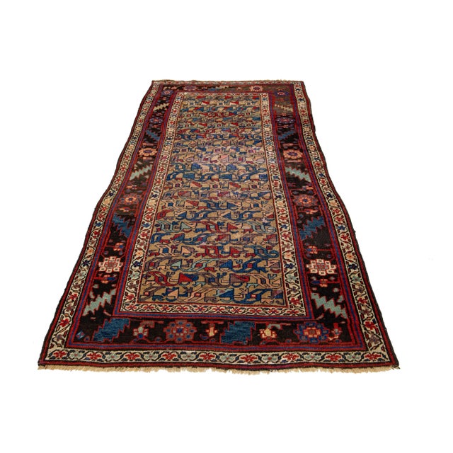 This is a beautiful antique Bidjar hand-knotted wool rug with a brown field. The all-over floral design has multi-color...