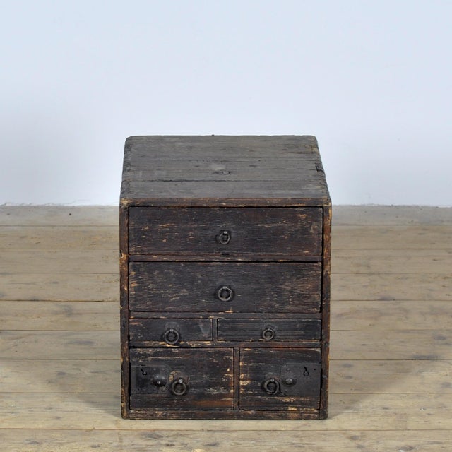 An atmospheric small Japanese *tansu*, designed as a compact *ko-dansu* with six drawers. The chest features...