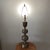 The Vintage Asian Inspired La James Mont Style Intricately Carved Brass Lamp from the 1940s is a stunning piece that...