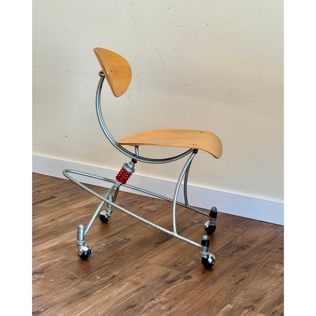 A rare signed sculptural chair by American designer Joey Manic (Joseph Boron), known for futuristic industrial furniture...