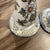 Beautiful vintage set of two candlestick holders featuring a delicate hand-painted floral design. Crafted in Portugal,...
