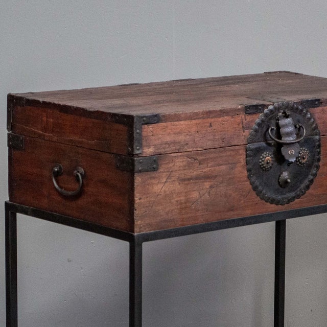 Unusual antique Japanese storage trunk made of paulownia (kiri) wood on a custom made metal stand with original hardware....