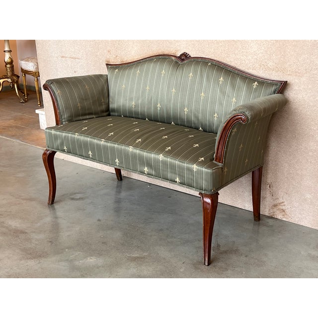 An unusual early 20th century Adam style carved mahogany window seat, having serpentine back and seat with scrolled out-...