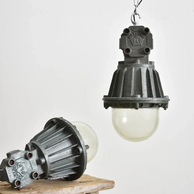An original heavy cast steel light manufactured by ‘maxlume’.the light was used in a chemical factory and consists of...