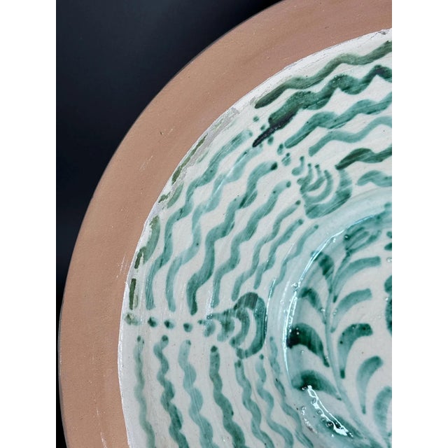Large Spanish handmade and painted white and green glazed terracotta "Lebrillo" earthenware bowl in the style typical of...