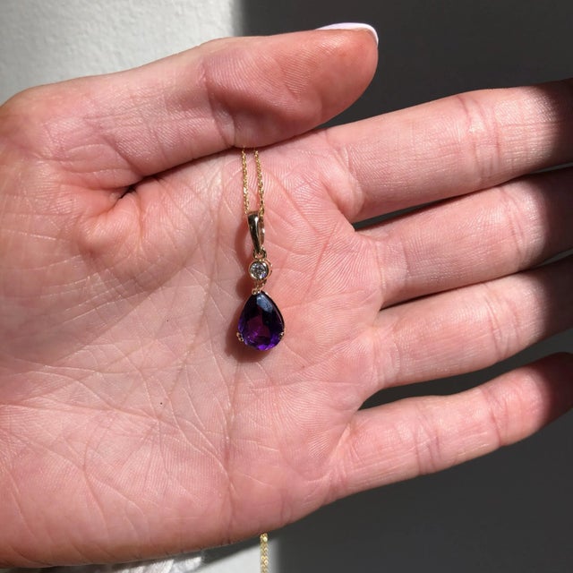 A rich purple amethyst pendant in a pear cut shape with a little natural diamond accent for a lovely added shine! If you...