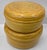 A striking set of five Oggetti graduated round lidded boxes handcrafted from tightly coiled bamboo strips with a warm...