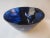 Exceptional bowl made of layered glass with three stylized floating figures, artistically shaped, cut and etched. After...